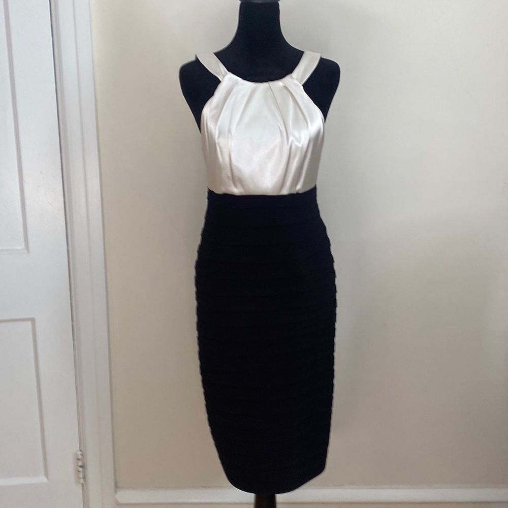 Night out or formal evening out. Sexy white and black dress! Form fitting!